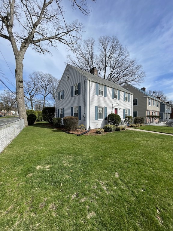 89 Wexford Street Springfield, MA 01118 - Photo 38 of 38 a view of a yard in front of a house with a large tree