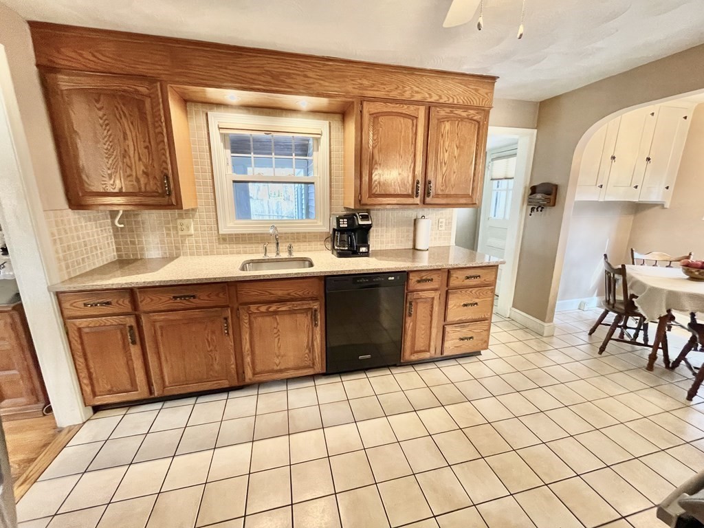 89 Wexford Street Springfield, MA 01118 - Photo 9 of 38 a kitchen with stainless steel appliances a sink stove and cabinets