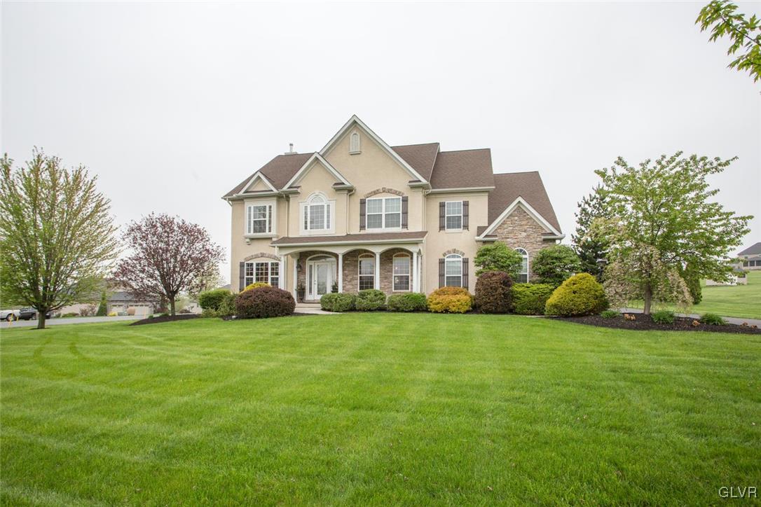 216 East Dell Road Bath, PA 18014 - Photo 1 of 42 a front view of a house with a garden