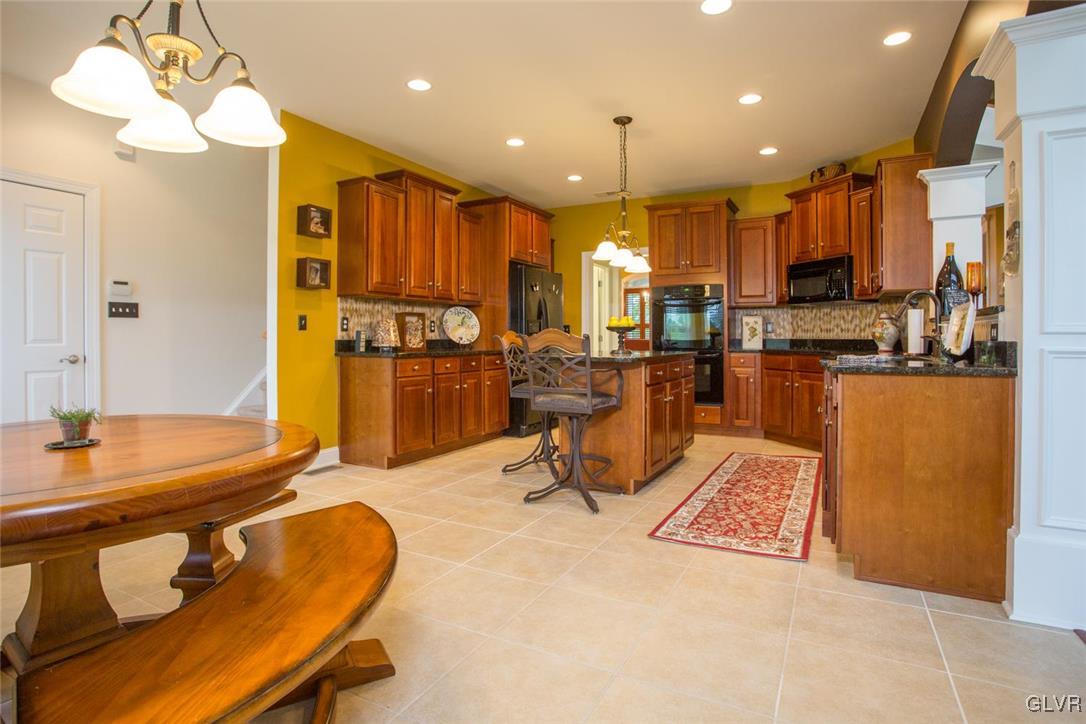 216 East Dell Road Bath, PA 18014 - Photo 13 of 42 a living room with kitchen island furniture and a kitchen view