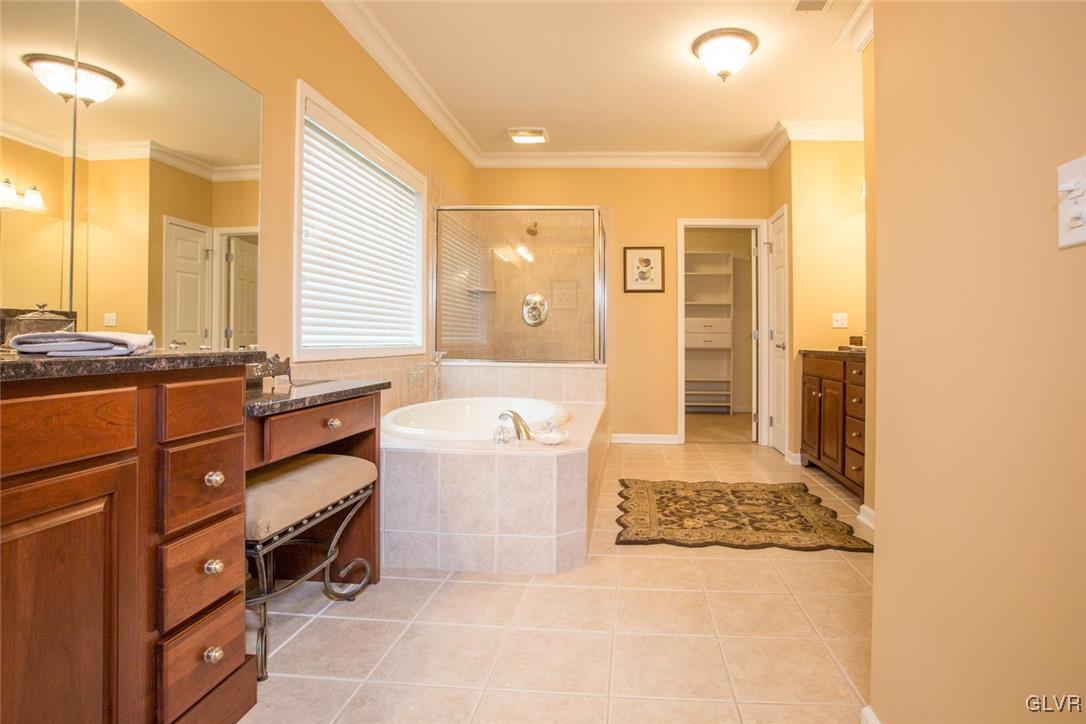 216 East Dell Road Bath, PA 18014 - Photo 24 of 42 a spacious bathroom with a tub sink and mirror