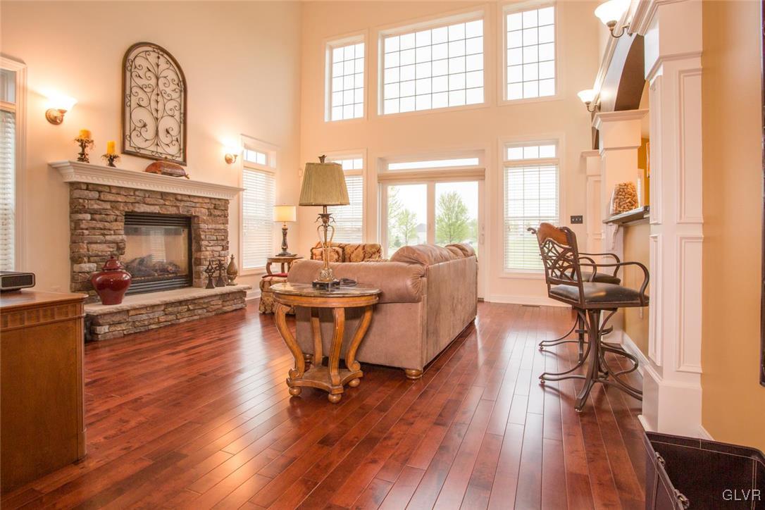 216 East Dell Road Bath, PA 18014 - Photo 8 of 42 a living room with furniture a fireplace and wooden floor