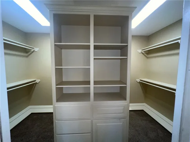 a view of an empty walk in closet