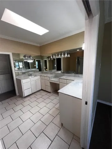 a kitchen with stainless steel appliances kitchen island granite countertop a refrigerator and a stove