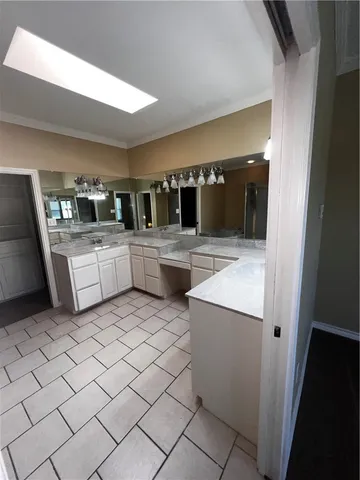 a kitchen with stainless steel appliances kitchen island granite countertop a refrigerator and a stove