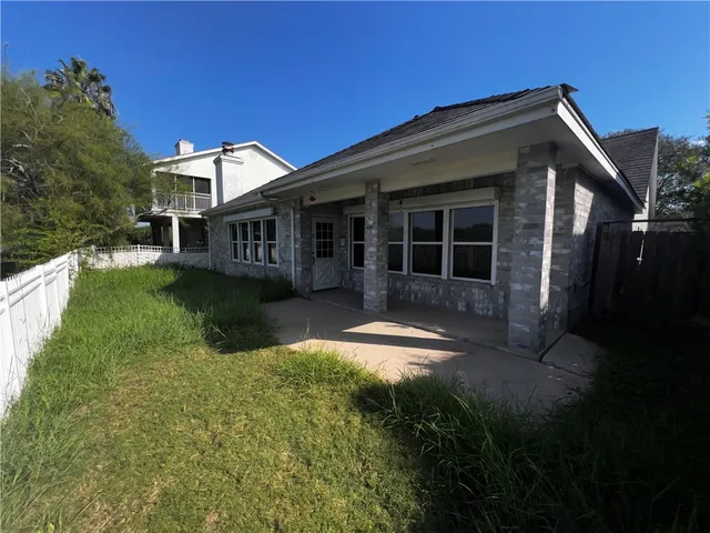 a view of house with yard and green space