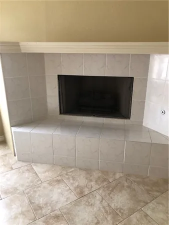 a fireplace with white wall
