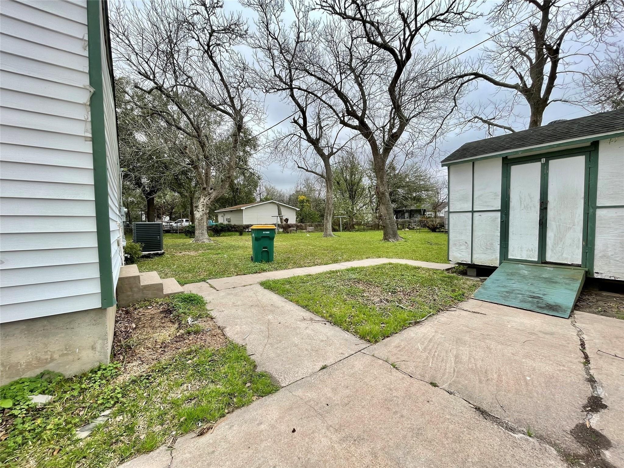 1827 Neuman La Marque, TX 77568 - Photo 20 of 23 a view of a house with a yard and tree s