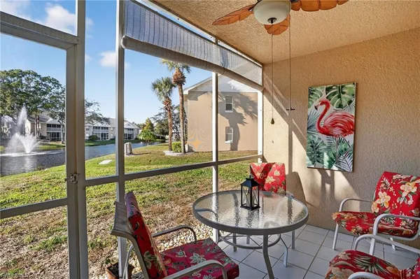 a view of a patio with table and chairs potted plants