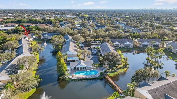 an aerial view of residential houses with outdoor space