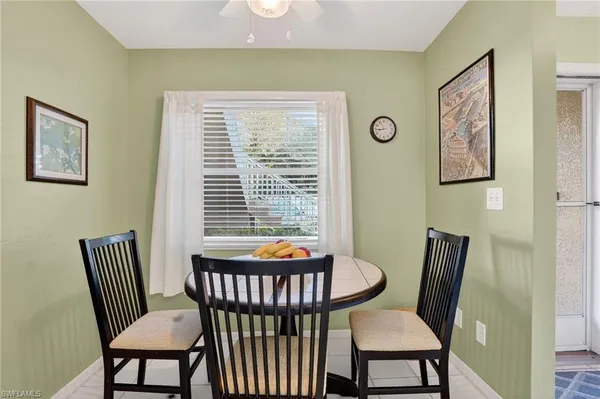 a view of a room with furniture wooden floor and window