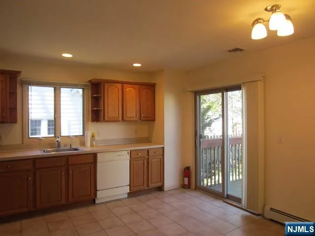 a large kitchen with a large window