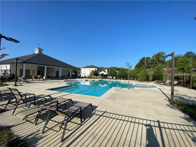 a view of a patio with swimming pool
