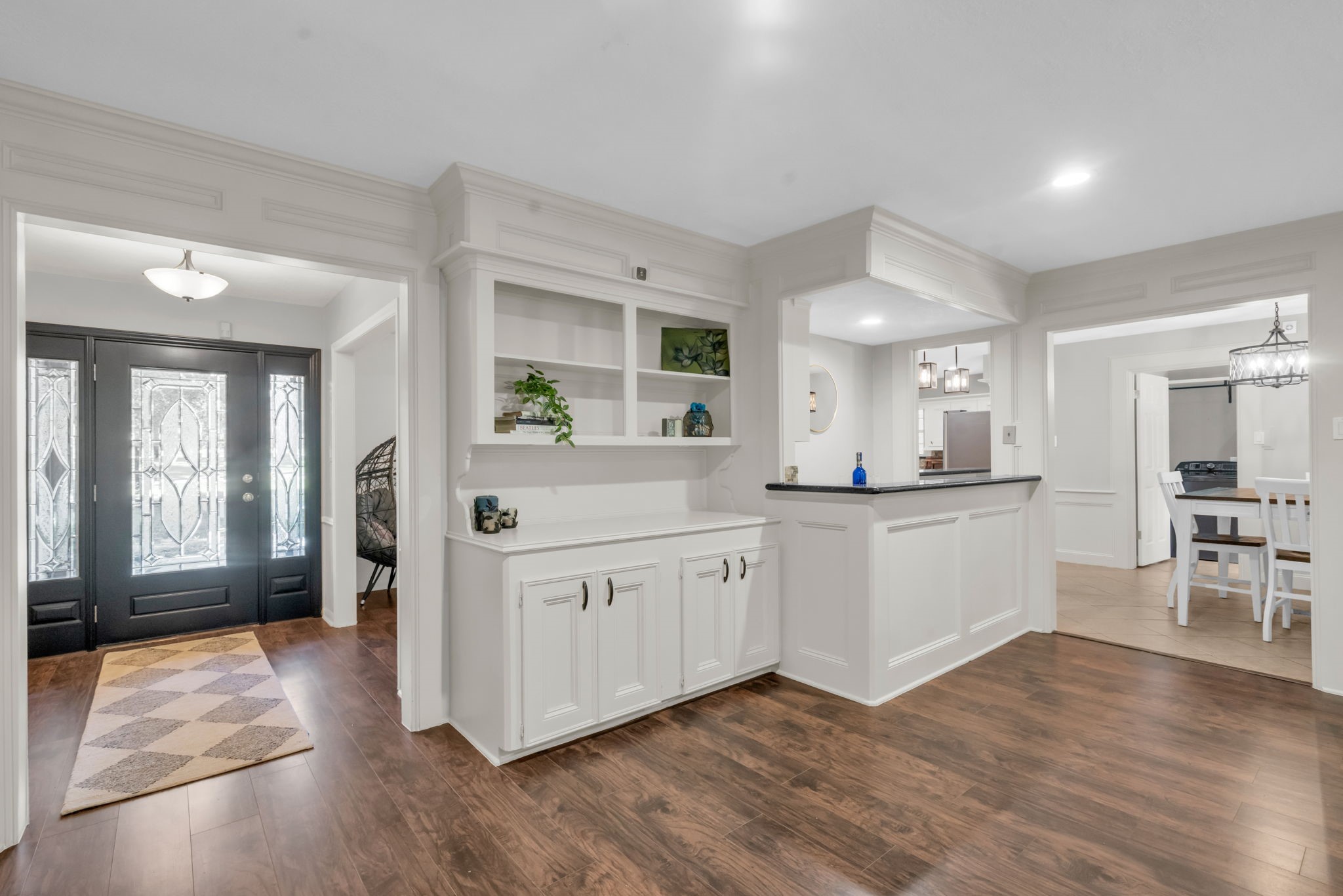 6514 Larkmount Drive Spring, TX 77389 - Photo 13 of 41 Custom book shelves and a wet bar create timeless character in this living space.