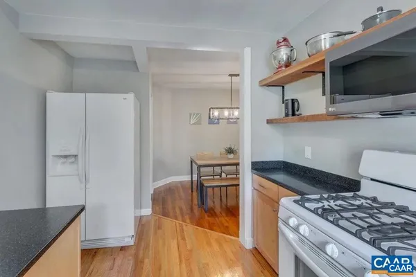 a kitchen with stainless steel appliances granite countertop a stove and a sink
