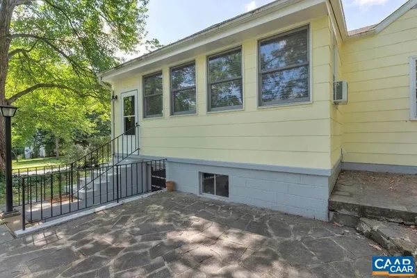 a view of a house with a backyard and a window