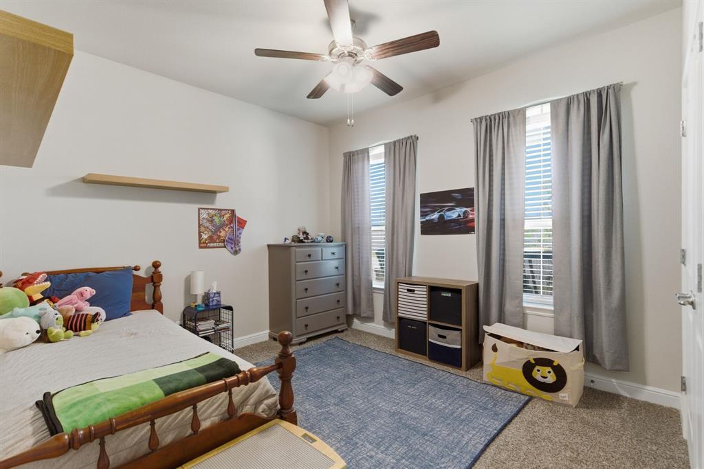 5621 Round Hl Road Denton, TX 76210 - Photo 19 of 27 a bedroom with furniture and a window