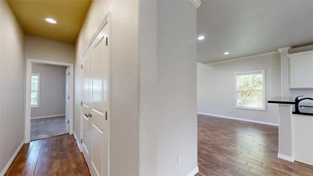 a kitchen with granite countertop a sink and cabinets
