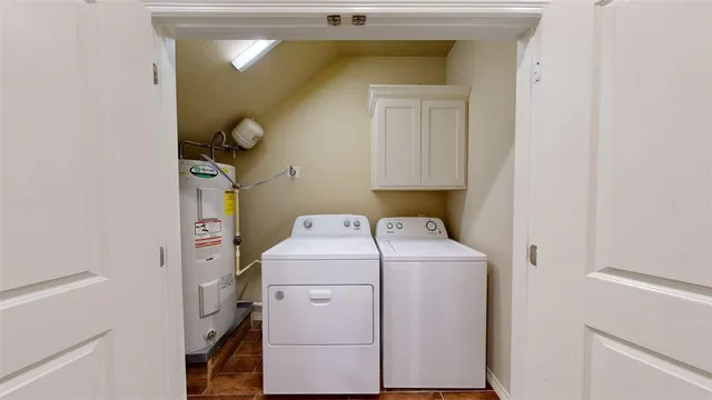 a view of a hallway with wooden floor and a bathroom