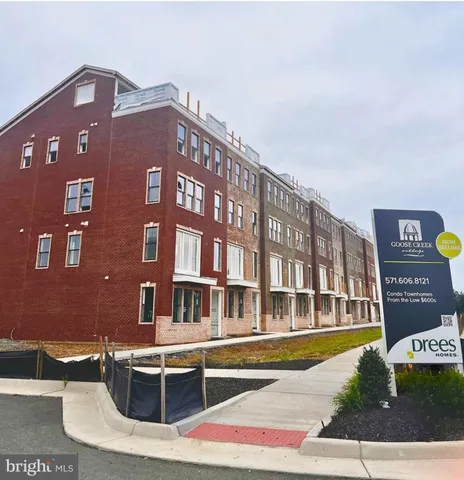 a front view of a building with glass windows