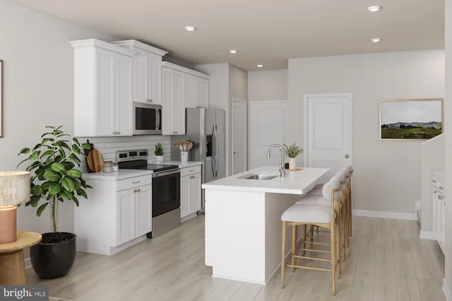 a kitchen with a sink stainless steel appliances and cabinets