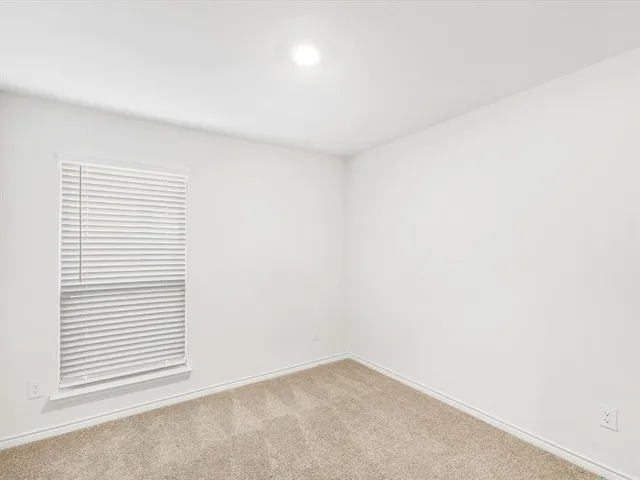 a view of a room that has a window in it