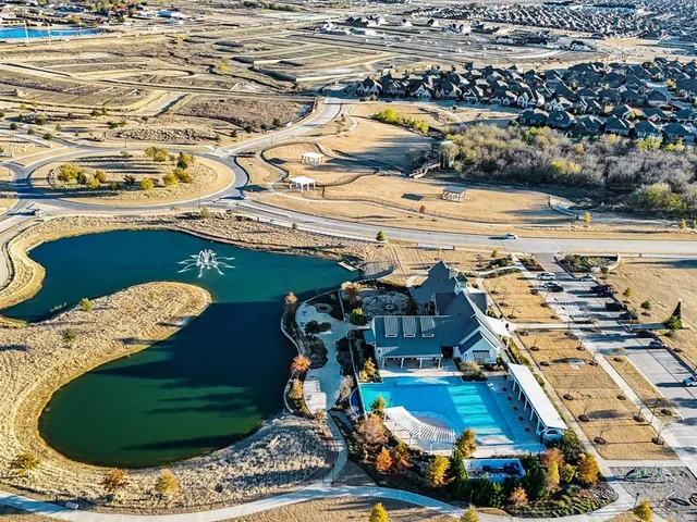 an aerial view of a house with outdoor space
