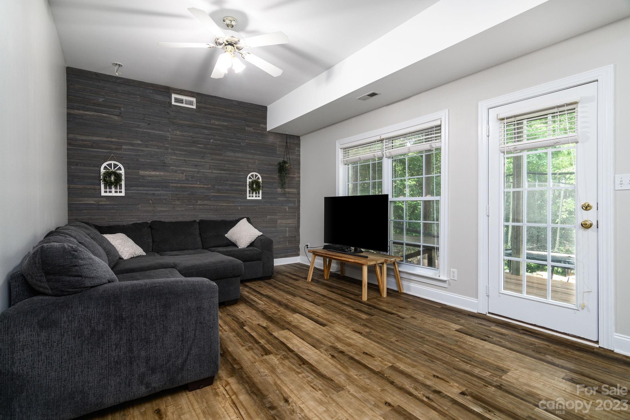 12129 Woodholm Court Tega Cay, SC 29708 - Photo 16 of 27 a living room with furniture and a flat screen tv