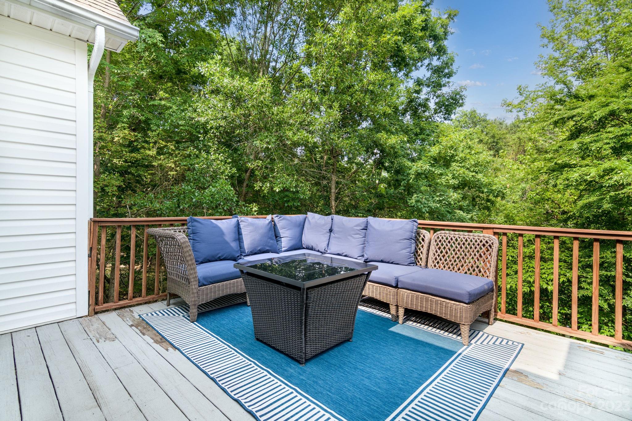 12129 Woodholm Court Tega Cay, SC 29708 - Photo 24 of 27 a roof deck with couches and wooden floor