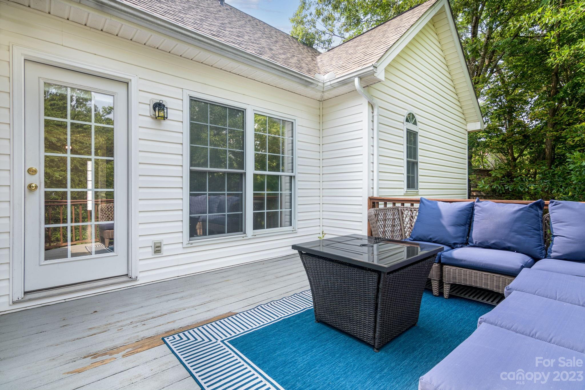 12129 Woodholm Court Tega Cay, SC 29708 - Photo 25 of 27 a view of a couches in the back yard of the house