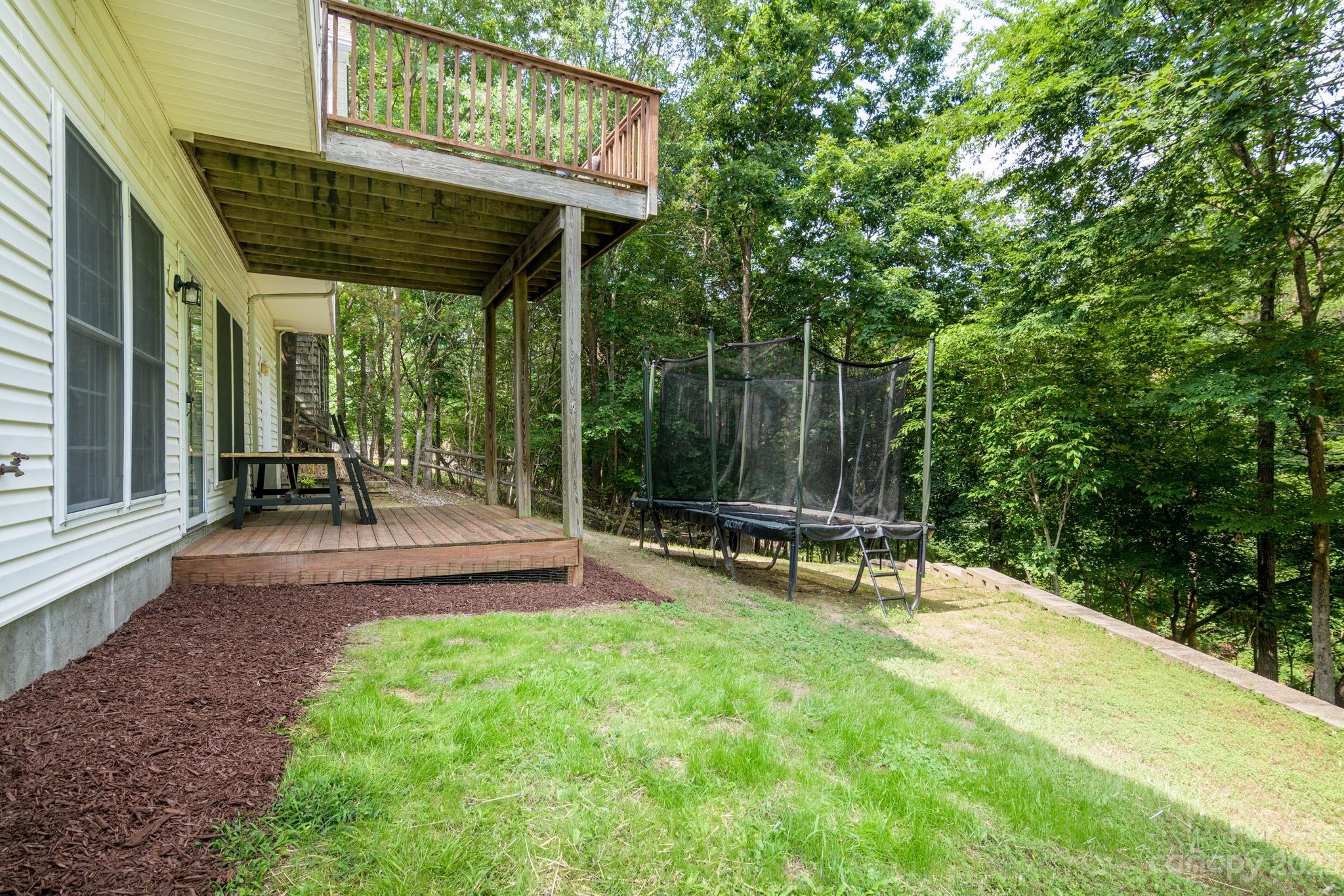 12129 Woodholm Court Tega Cay, SC 29708 - Photo 27 of 27 a view of a patio with a table and chairs