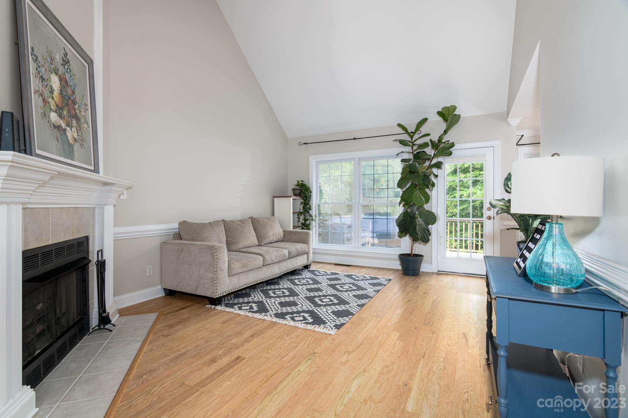 12129 Woodholm Court Tega Cay, SC 29708 - Photo 5 of 27 a living room with furniture and a fireplace