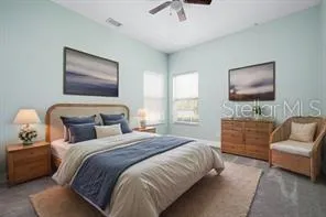 a bedroom with bed and a couch