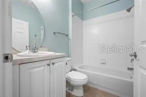 a bathroom with a sink a toilet and a bathtub