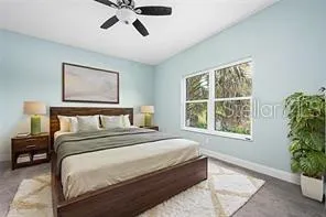 a bedroom with bed and a window
