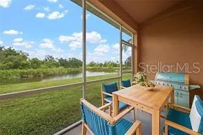 a view of an outdoor sitting area with furniture