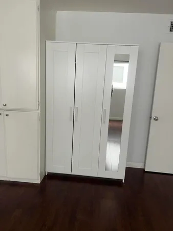 an empty room with wooden floor