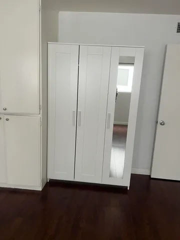 an empty room with wooden floor