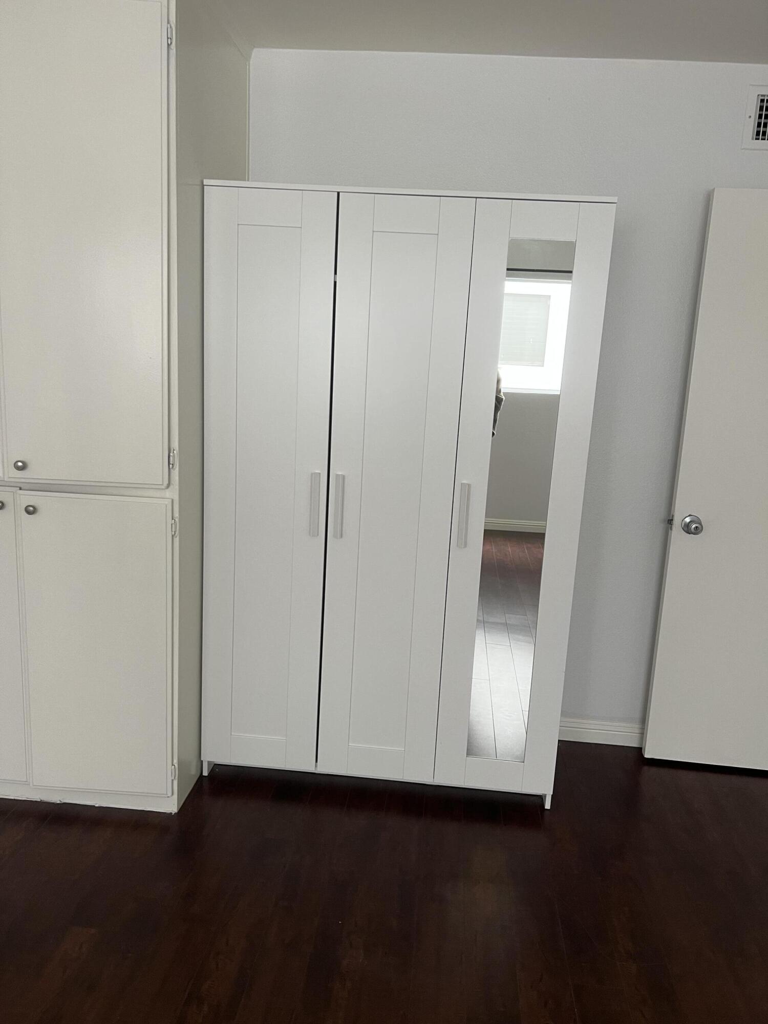 18555 Collins Street, Unit C8 Tarzana, CA 91356 - Photo 15 of 32 a view of an empty room with wooden floor and closet