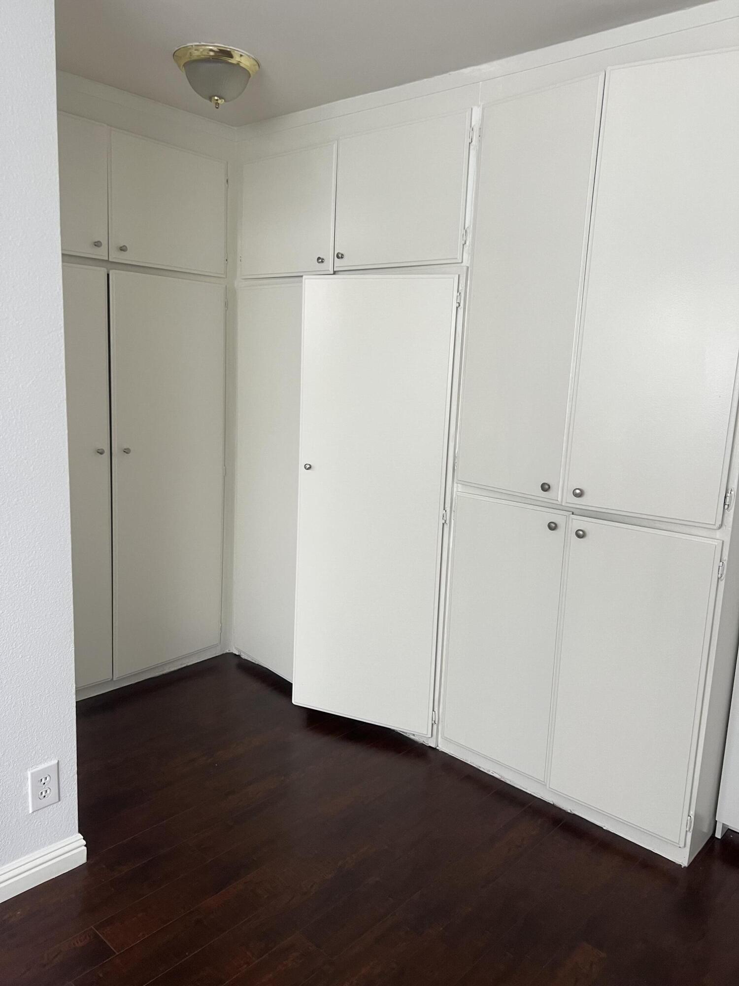 18555 Collins Street, Unit C8 Tarzana, CA 91356 - Photo 16 of 32 an empty room with wooden floor