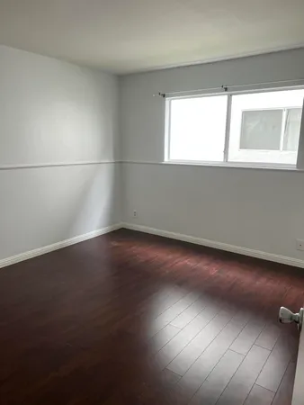 a bathroom with a toilet a sink and a shower