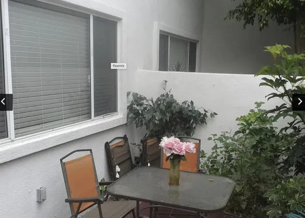 a front view of a house with tree s