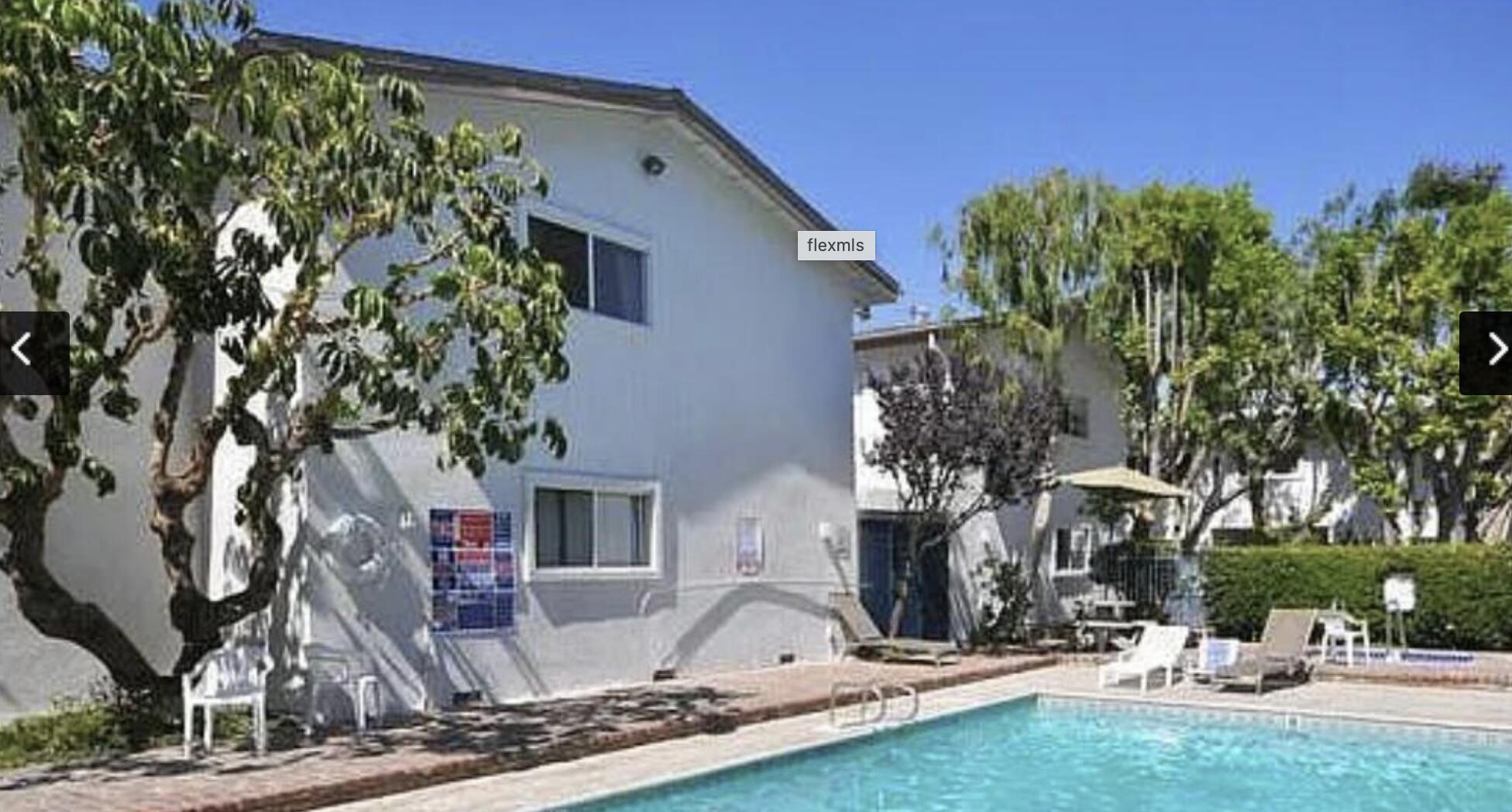 18555 Collins Street, Unit C8 Tarzana, CA 91356 - Photo 23 of 32 a front view of a house with tree s