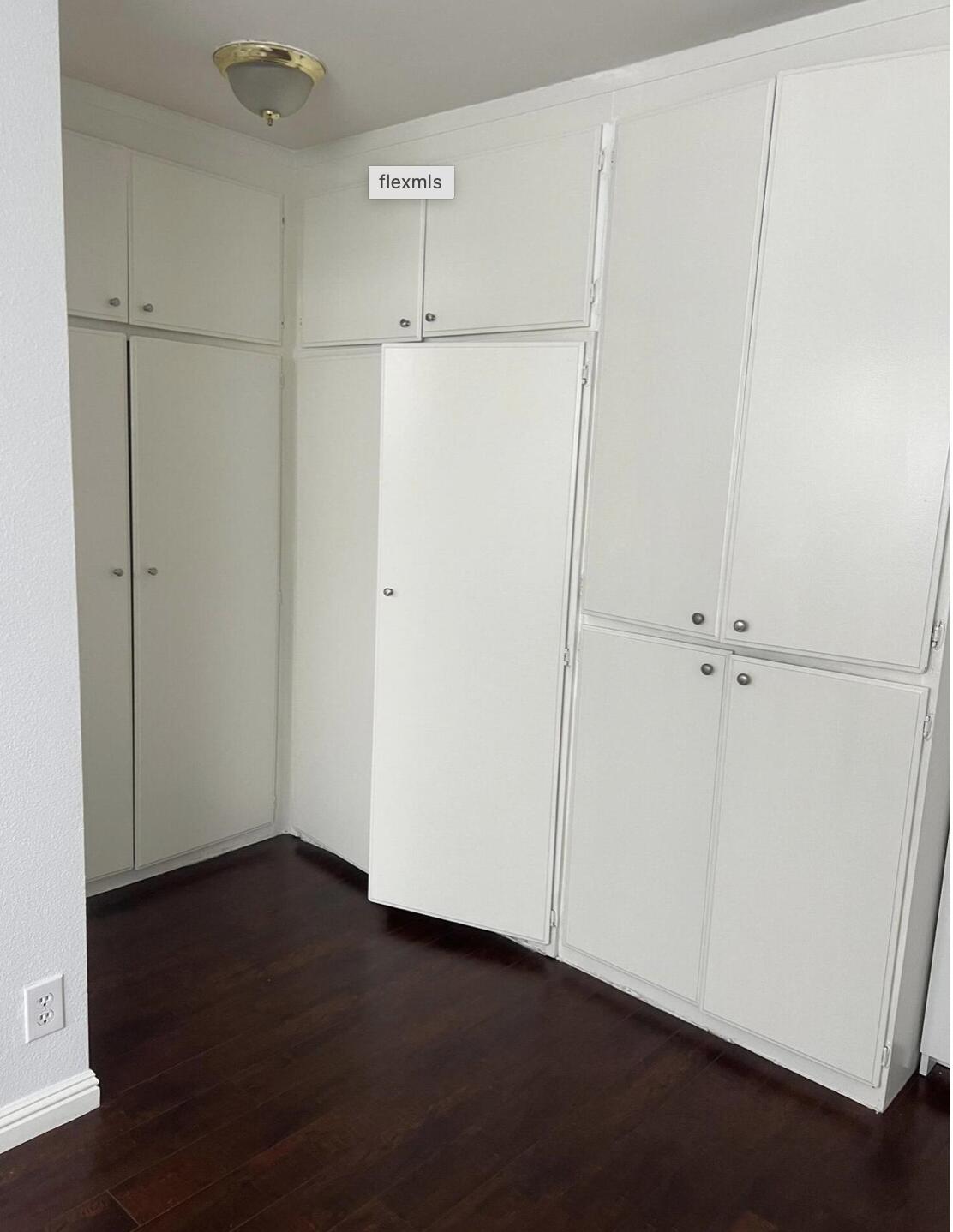 18555 Collins Street, Unit C8 Tarzana, CA 91356 - Photo 29 of 32 an empty room with wooden floor