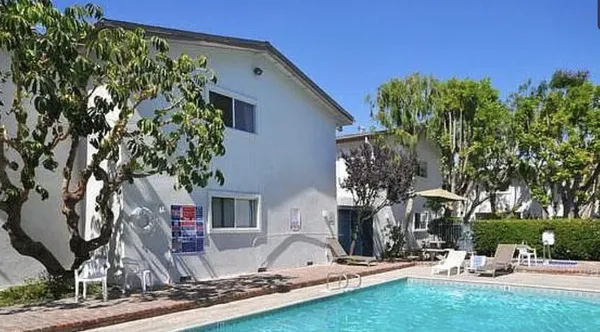 a view of house with yard