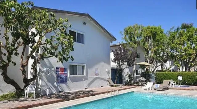 a view of house with yard