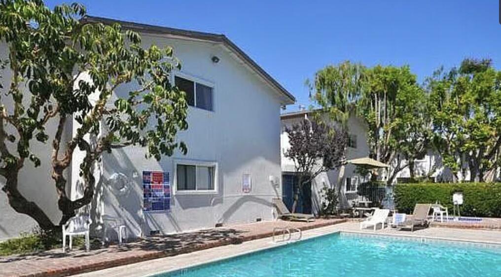 18555 Collins Street, Unit C8 Tarzana, CA 91356 - Photo 7 of 32 a view of house with yard