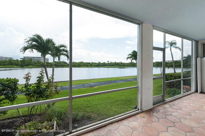 2165 Ibis Isle Road, Unit 2 Palm Beach, FL 33480 - Photo 2 of 7 a view of a yard and a large window