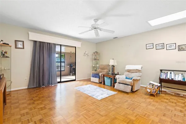 a living room with furniture rug and window