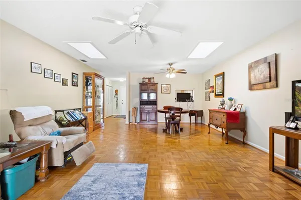 a dining room with furniture and window